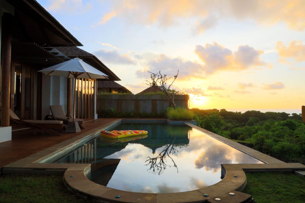 Serene infinity pool at a luxury villa in Bali at sunset