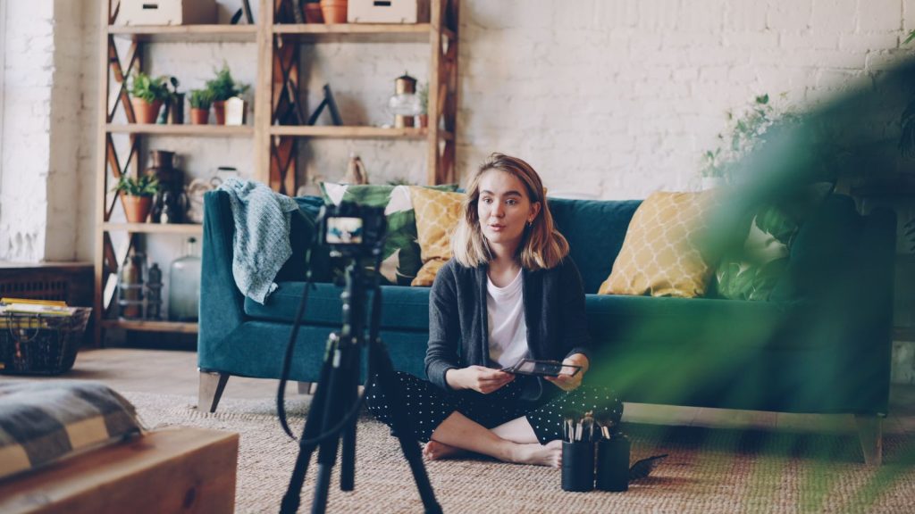 Content creator recording video with a camera setup