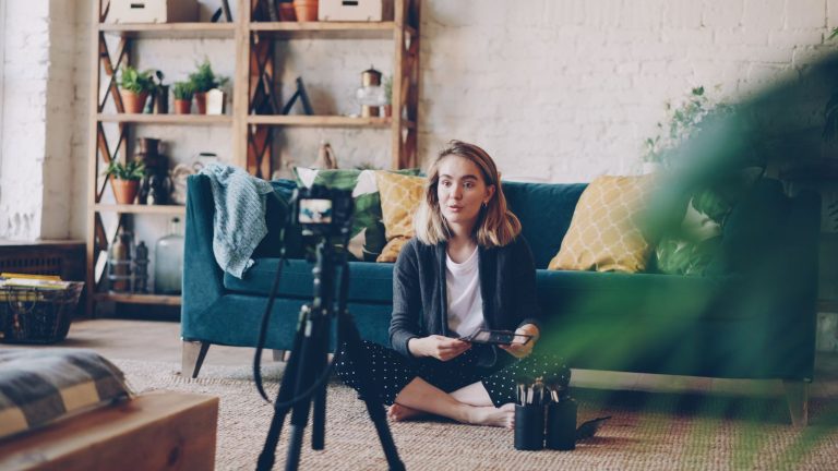 Content creator recording video with a camera setup